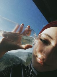 Close-up portrait of man drinking glass