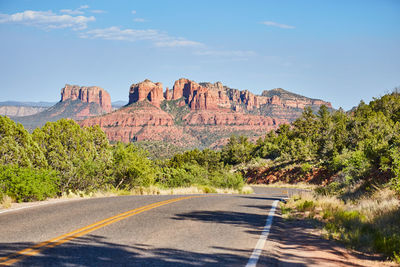 Road amidst mountain against sky