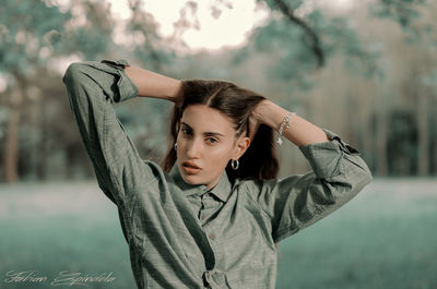 Portrait of a young woman standing outdoors