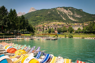 Scenic view of lake by buildings against sky