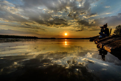 Scenic view of sunset over lake