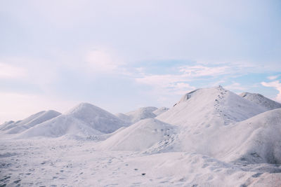 Scenic view of snow covered mountains against sky