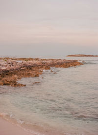 Scenic view of beach and sea against sky