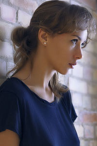 Portrait of young woman looking away