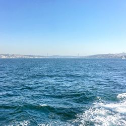 Scenic view of sea against clear blue sky