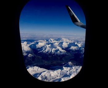 Aerial view of landscape seen through airplane window