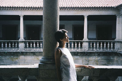 Girl contemplating the cloisters of the convent on viseu