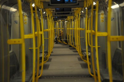 View of yellow lights on footpath