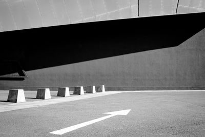 Low section of directional arrow on car park 