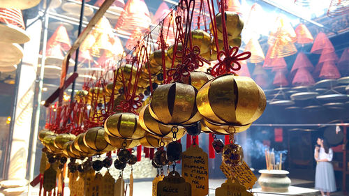 Low angle view of lanterns hanging for sale at market stall