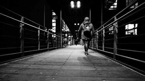 Full length of man on road in city at night
