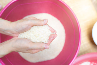 Cropped hand of person preparing food