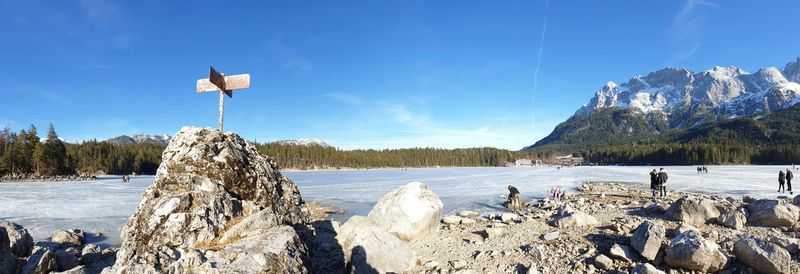 Panoramic view of frozen lake against sky during winter