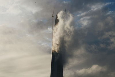 Low angle view of vapor trail against sky