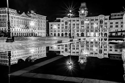 Reflection of building in city at night