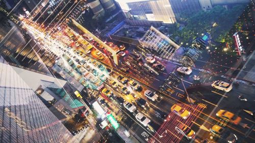 High angle view of city lit up at night