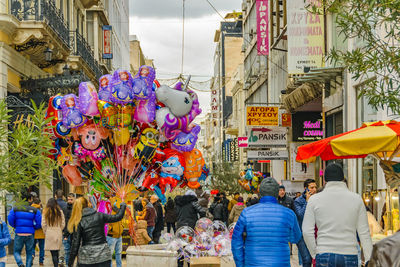 People on street market in city