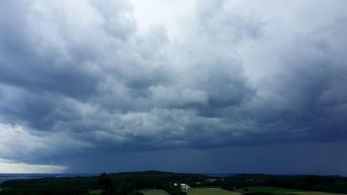 Scenic view of landscape against cloudy sky