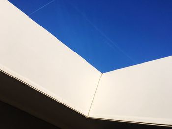 Low angle view of built structure against clear blue sky