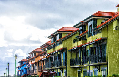 A beautiful colorful buildings on the coast under rainy weather in noja, cantabria spain