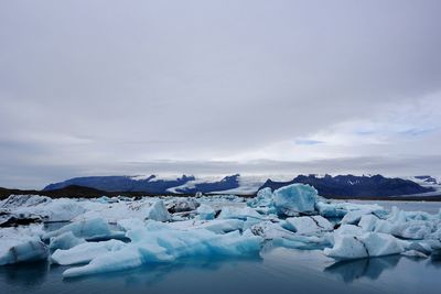 View of icebergs floating on water