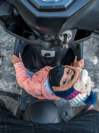 High angle portrait of woman in car