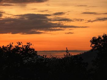 Scenic view of dramatic sky during sunset