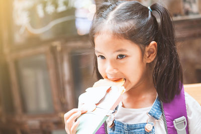 Portrait of a girl holding ice cream