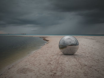 Sea shore on beach against sky