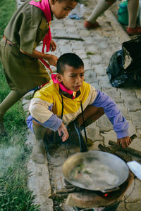 High angle view of boy cooking food 