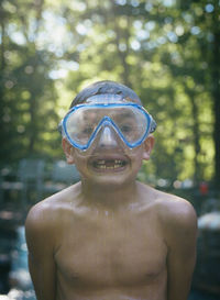 Portrait of smiling boy wearing swimming goggles