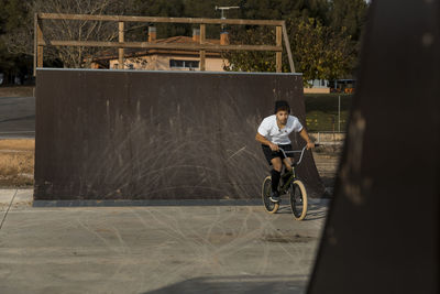 Man riding bicycle on street