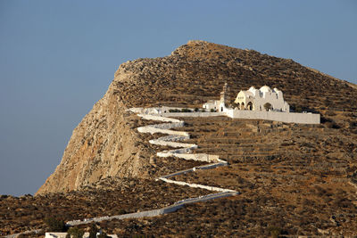 Low angle view of rock formations against clear sky