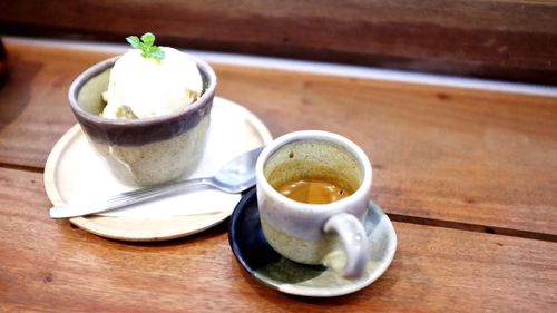 Close-up of cup and coffee on table