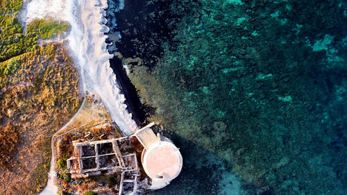 High angle view of rocks by sea