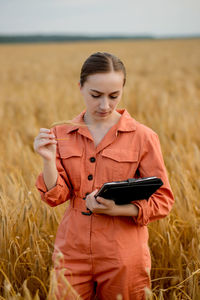 Portrait of young woman using mobile phone