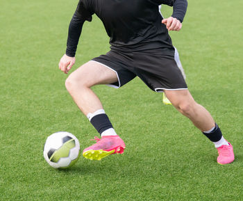 Man playing soccer at park