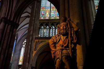 Low angle view of statue against building