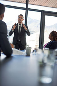 Manager giving presentation during meeting at office