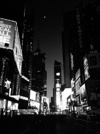 Buildings in city at night