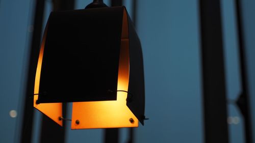 Low angle view of illuminated pendant light