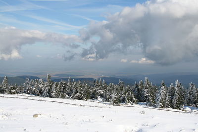 Scenic view of snow covered landscape against sky