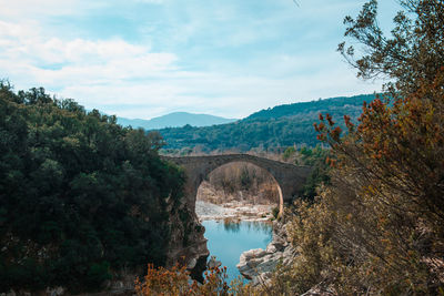 Bridge over river against sky