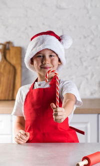 Portrait of young woman holding gift