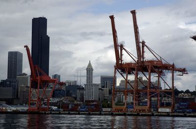 View of skyscrapers against cloudy sky