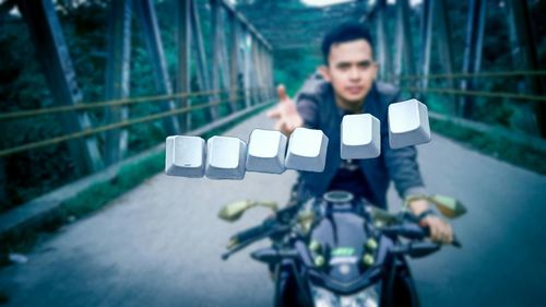 Portrait of man sitting on bicycle