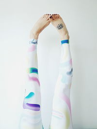 Mid section of man against white background