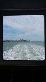 View of cityscape against cloudy sky