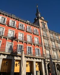 Low angle view of building against blue sky