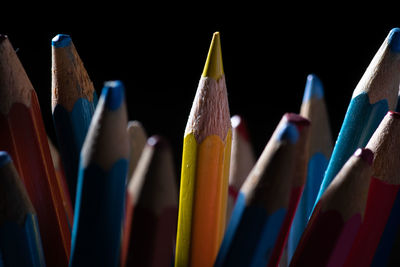 A yellow pen in a lake of blue and red 